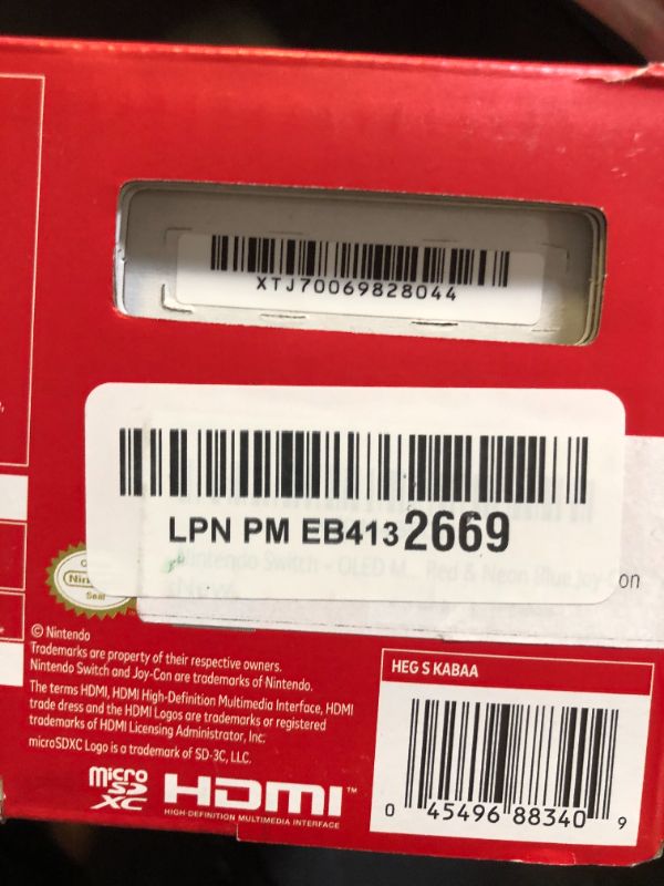 Photo 1 of Nintendo Switch – OLED Model w/ Neon Red & Neon Blue Joy-Con
