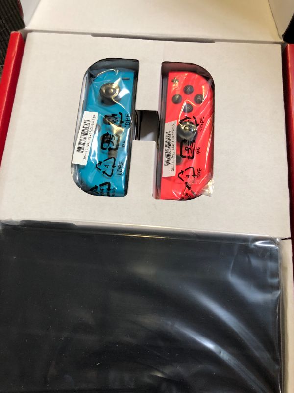 Photo 1 of Nintendo Switch – OLED Model w/ Neon Red & Neon Blue Joy-Con