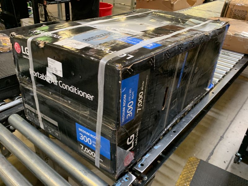Photo 1 of -FACTORY SEALED- LG 7,000 BTU Portable Air Conditioner, 115V, Cools 300 Sq.Ft. (12' x 25' Room Size), Portable Air Conditioner for Home with Quiet Operation, LCD Remote Control, and Window Installation Kit, White