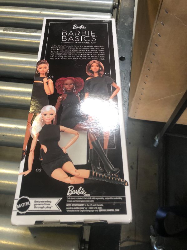 Photo 1 of Barbie Basics Model 03 Collector Doll with Red Curly Hair, Black Mini Dress & Boots, Universal-fit Fashions, Posable Tall Body & Swappable Doll Head