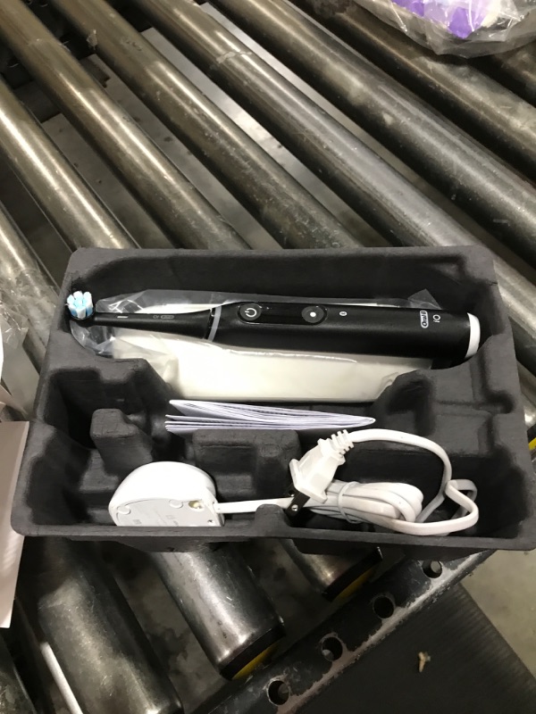 Photo 1 of Oral-B iO Deep Clean + Protect Rechargeable Electric Toothbrush, Black with a iO Series 7 Toothbrush, 2 Replacement Brush Heads, and a Charging Travel Case