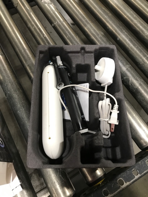 Photo 1 of Oral-B iO Deep Clean + Protect Rechargeable Electric Toothbrush, Black with a iO Series 7 Toothbrush, 2 Replacement Brush Heads, and a Charging Travel Case