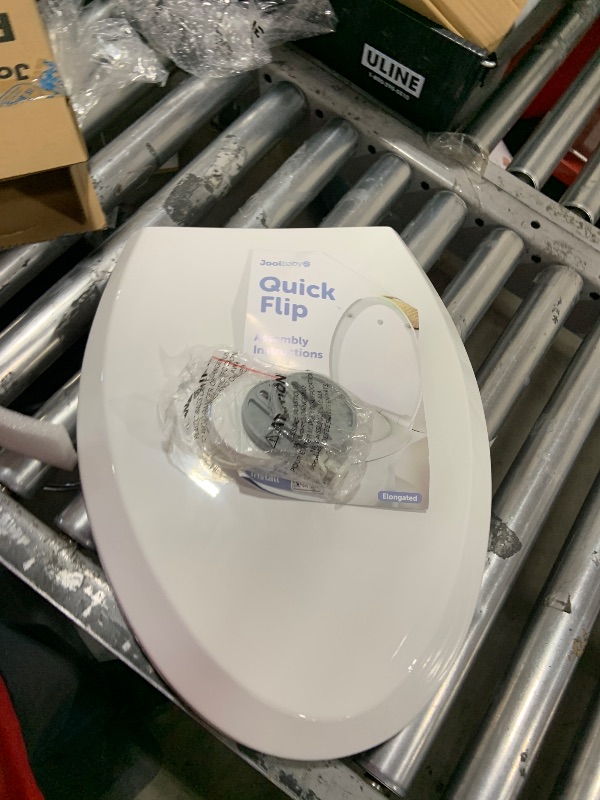 Photo 1 of Quick Flip Elongated Toilet Seat with Built-In Potty & Splash Guard for Toddler Training, Slow Close - Jool Baby