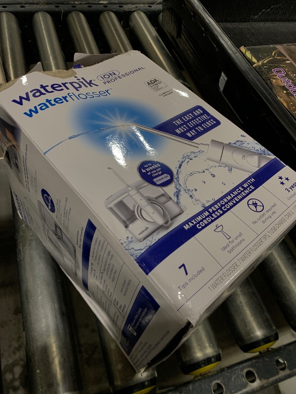 Photo 1 of Waterpik ION Professional Water Flosser, Rechargeable and Portable for Teeth, Gums, Braces, 10 Settings, 7 Flossing Tips For Multiple Users And Needs, ADA Accepted, WF-12 White, Packaging May Vary