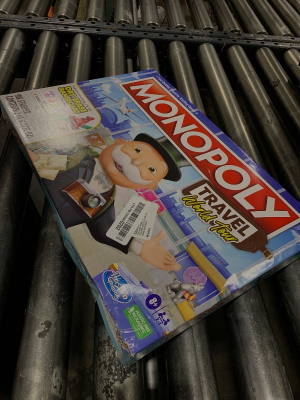 Photo 1 of Hasbro Gaming Monopoly World Tour Board Game with Token Stampers and Dry-Erase Gameboard for Family Game Night