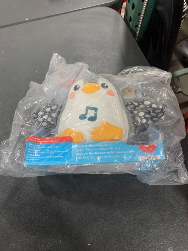 Photo 1 of Fisher-Price Baby Tummy Time Toy Flap & Wobble Penguin, Plush with Music & Motion for Sensory Play Newborns Ages 0+ Months