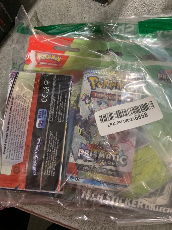 Photo 1 of Pokémon TCG: Leafeon Scarlet and Violet Expansion Sticker Collection - Prismatic Evolutions (one Holographic Promo Card and Three Expansion Packs)