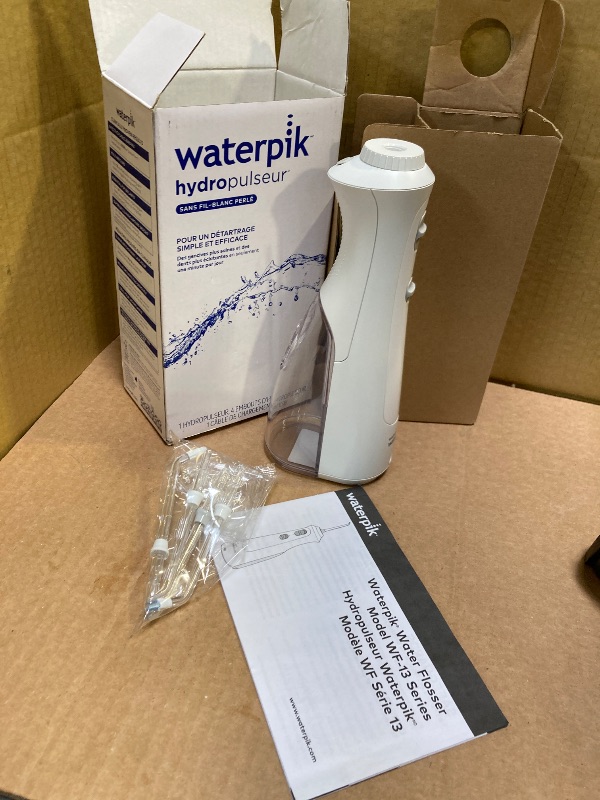 Photo 1 of Waterpik Cordless Pearl Rechargeable Portable Water Flosser for Teeth, Gums, Braces Care and Travel with 4 Flossing Tips - ADA Accepted, WF-13 White, Packaging May Vary