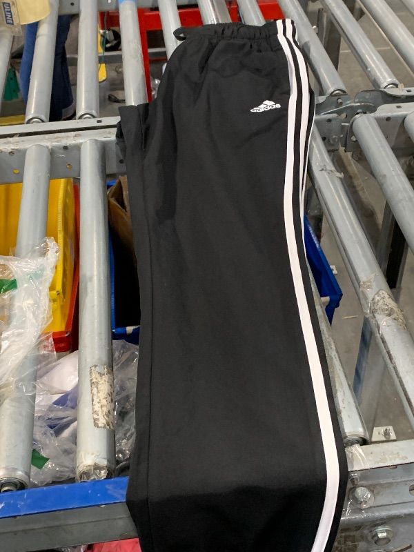 Photo 1 of adidas Women's Essentials Fleece Tapered Cuff Pants, Black, Medium