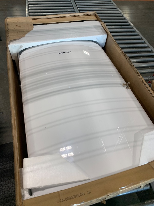 Photo 1 of Amazon Basics Portable AC (Air Conditioner) with Heat Pump, Dual Purpose (Cool and Warm), Cools 550 Square Feet, With Remote Control and Timer, 13,000 BTU ASHARE / 10000 BTU SACC, White