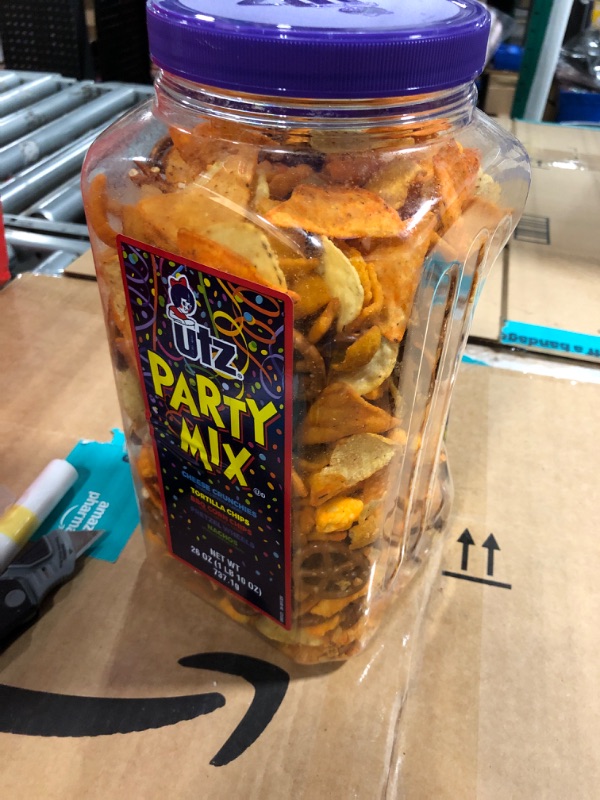 Photo 1 of **EXP JAN/2025**Utz Party Mix - 26 Ounce Barrel - Tasty Snack Mix Includes Corn/Nacho Tortillas, Pretzels, BBQ Corn Chips and Cheese Curls, Easy and Quick Party Snacks, Cholesterol Free and Trans-Fat Free