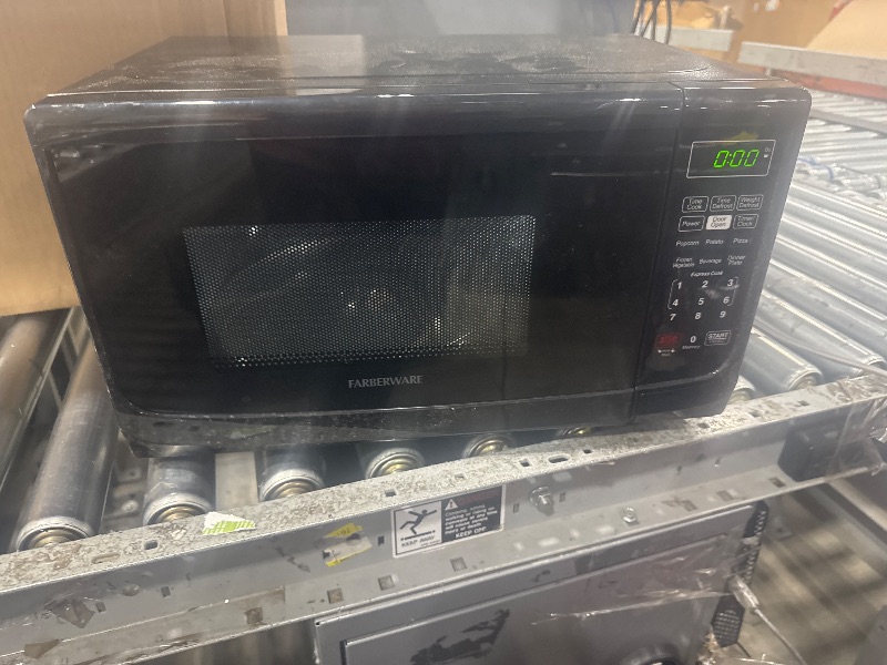 Photo 1 of **SEE NOTES***Farberware Countertop Microwave 700 Watts, 0.7 Cu. Ft. - Microwave Oven With LED Lighting and Child Lock - Perfect for Apartments and Dorms - Easy Clean Grey Interior, Retro Black
