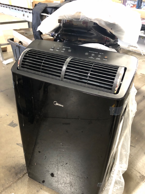 Photo 1 of ***USED - POWERS ON - UNABLE TO TEST FURTHER - NO PACKAGING - LIKELY MISSING PARTS***
Midea Duo 14,000 BTU (12,000 BTU SACC) High Efficiency Inverter Ultra Quiet Portable Air Conditioner, with Heat up to 550 Sq. Ft., Works with Alexa/Google Assistant, wit