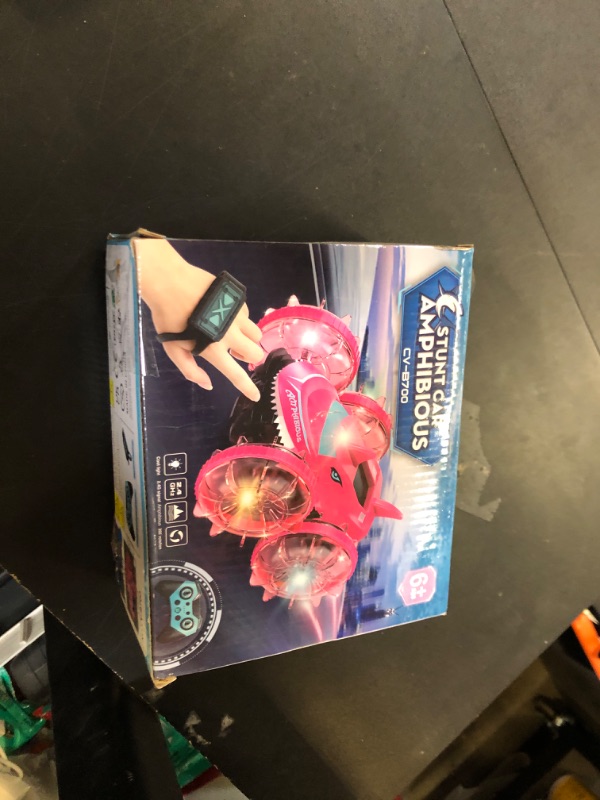 Photo 1 of Axirata Amphibious RC Car with Lights for Kids 3-12 Year Old Boys Toy Gesture Hand Remote Control Boat 4WD 2.4GHz Waterproof RC Stunt Car 360° Rotating Water Beach Pool Toys Gift for Boys Girls