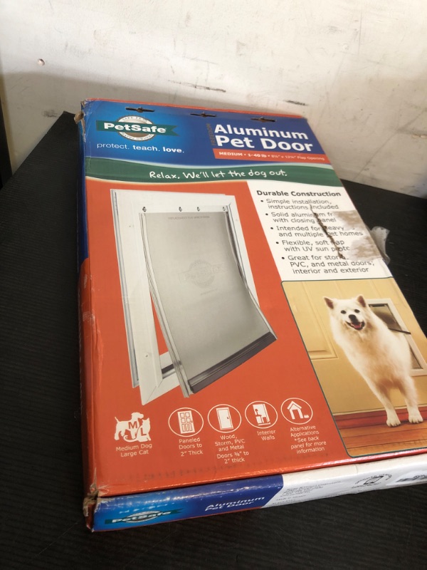 Photo 2 of PetSafe Freedom Aluminum Pet Door for Dogs and Cats, Medium, White, Tinted Vinyl Flap