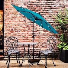 Photo 1 of 10 ft. Aluminum Market Solar Lighted Tilt Patio Umbrella with LED in Aqua Blue Solution Dyed Polyester


