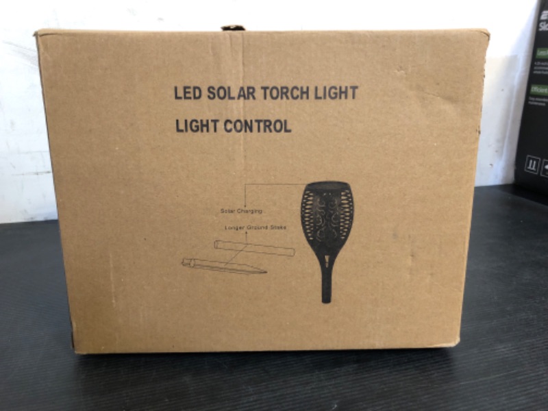 Photo 1 of Upgraded 8 Pack Super Larger Size Solar Flame Torch Extra Bright Solar Lights Outdoor Decorative with Flickering Flame, Solar Outdoor Lights Waterproof for Garden Pathway Yard Party, Auto On and Off