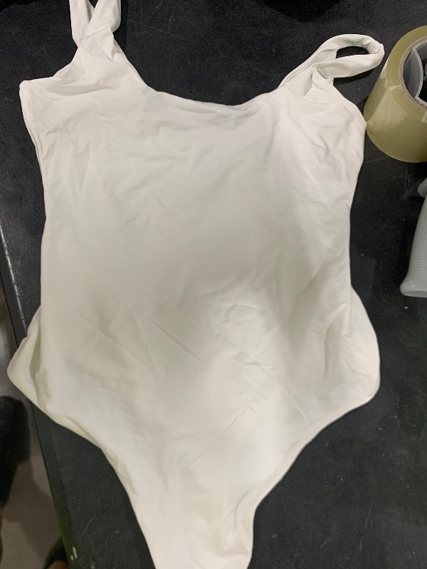 Photo 1 of small white woman's body suit 