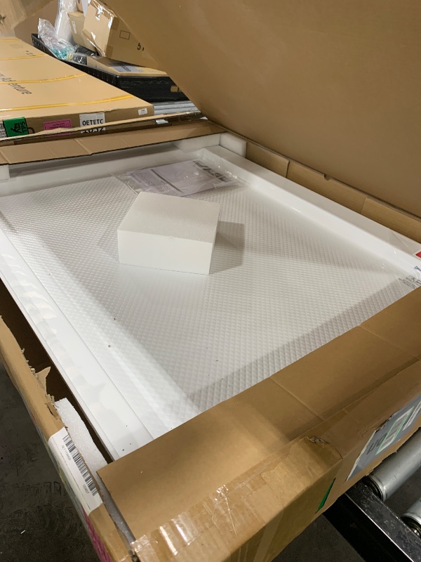 Photo 1 of DreamLine SlimLine 34 in. D x 42 in. W x 2 3/4 in. H Center Drain Single Threshold Shower Base in White, DLT-1134420
