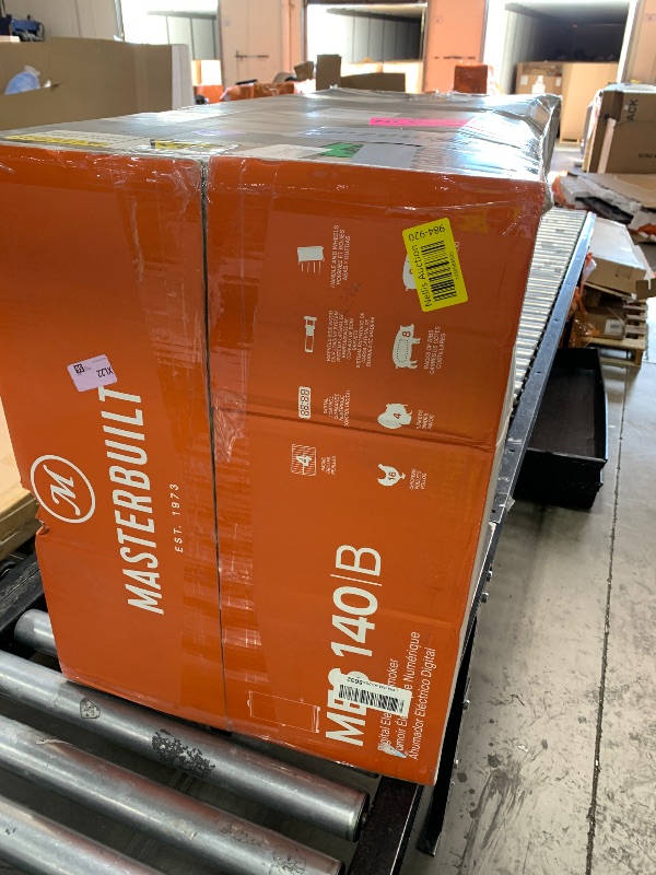 Photo 1 of Masterbuilt® 40-inch Digital Electric Vertical BBQ Smoker with Side Wood Chip Loader