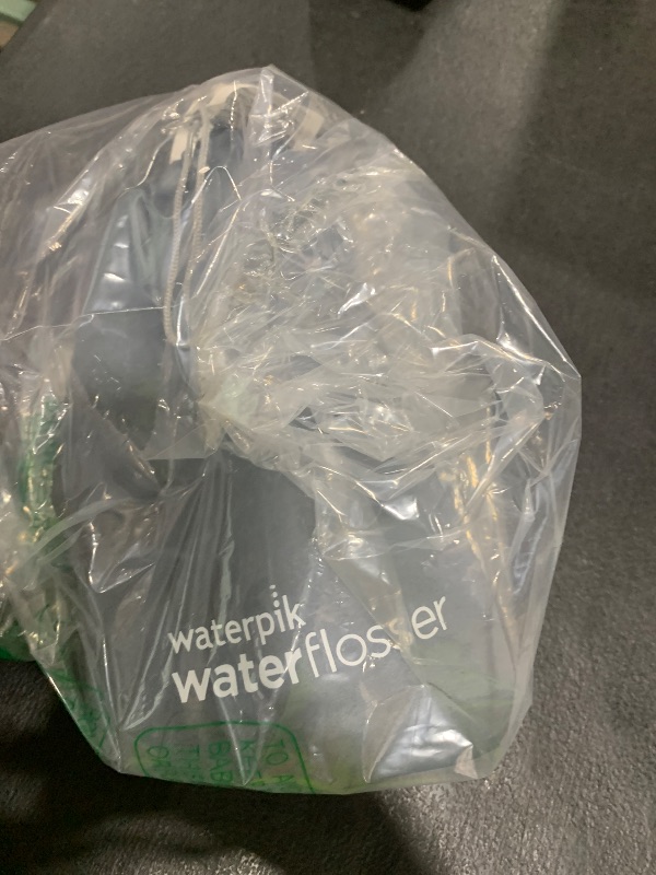 Photo 1 of Waterpik Cordless Advanced 2.0 Water Flosser For Teeth, Gums, Braces, Dental Care With Travel Bag and 4 Tips, ADA Accepted, Rechargeable, Portable, and Waterproof, Black WP-582, Packaging May Vary
