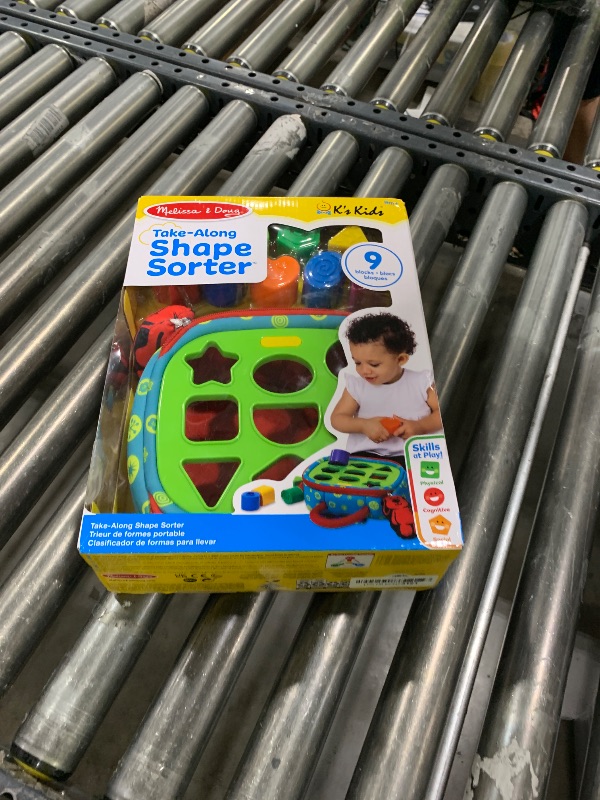 Photo 1 of Melissa & Doug K's Kids Take-Along Shape Sorter Baby Toy with 2-Sided Activity Bag and 9 Textured Shape Blocks