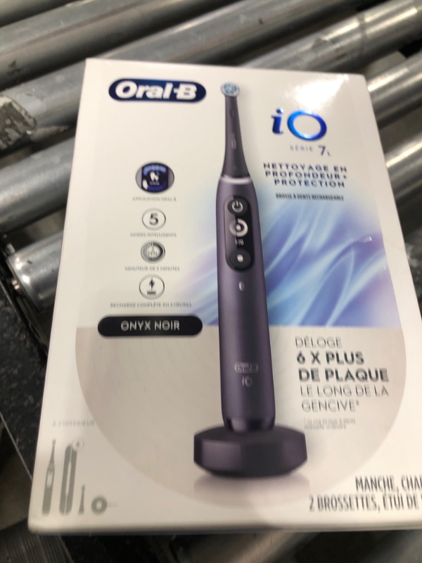 Photo 1 of Oral-B iO Deep Clean + Protect Rechargeable Electric Toothbrush, Black with a iO Series 7 Toothbrush, 2 Replacement Brush Heads, and a Charging Travel Case