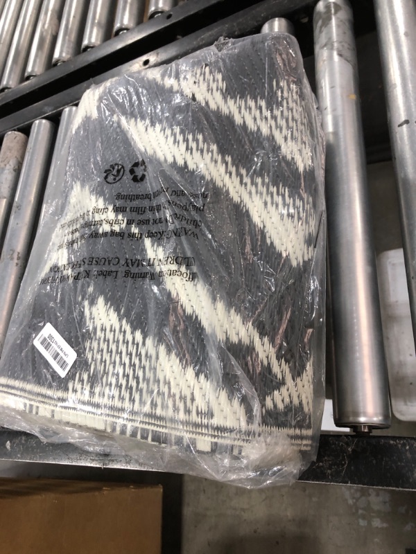 Photo 1 of MontVoo Outdoor Rug Waterproof-Patio Rug Mat 5x7 Outdoor Carpet Reversible RV Camping Picnic Plastic Straw Rug Outside Outdoor Area Rug for Balcony Deck Backyard Patio Decor Modern Abstract