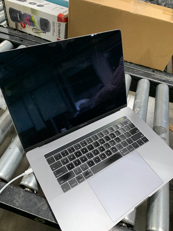 Photo 1 of Apple Mid 2019 MacBook Pro with 2.3 GHz Intel Core i9, 15-inch, 16GB RAM, 512GB SSD Space Gray (Renewed)