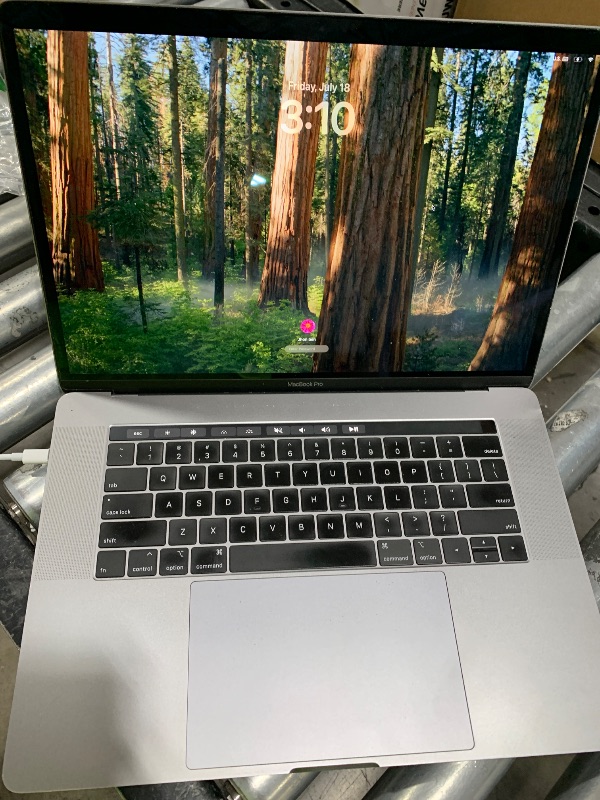 Photo 1 of Apple Mid 2019 MacBook Pro with 2.3 GHz Intel Core i9, 15-inch, 16GB RAM, 512GB SSD Space Gray (Renewed)