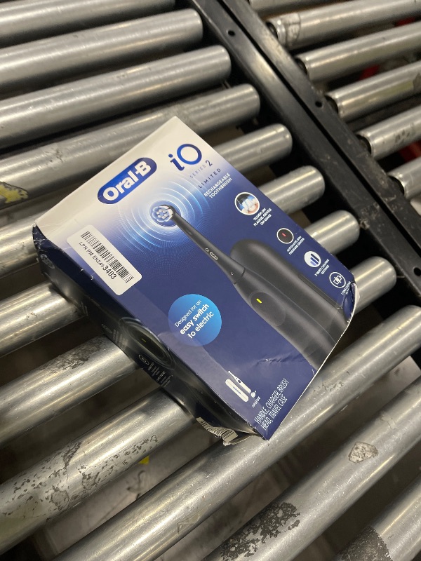 Photo 1 of Oral-B iO Simple Clean Rechargeable Electric Powered Toothbrush, Night Black with 1 Gentle Care Brush Head and 1 Black Travel Case - Automatic Pressure Sensor to Protect Gums - 3 Modes - 2 Min Timer