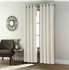 Photo 1 of Shadow Blackout Grommet Curtain Panel 52 x 63 in Off-white with pom poms at bottom