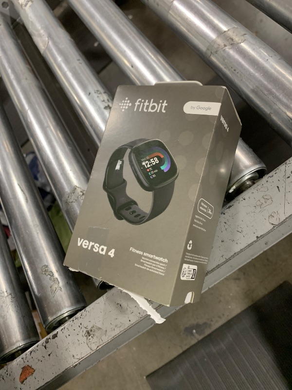 Photo 1 of Fitbit Versa 4 Fitness Smartwatch with Daily Readiness, GPS, 24/7 Heart Rate, 40+ Exercise Modes, Sleep Tracking and more, Black/Graphite, One Size (S & L Bands Included)