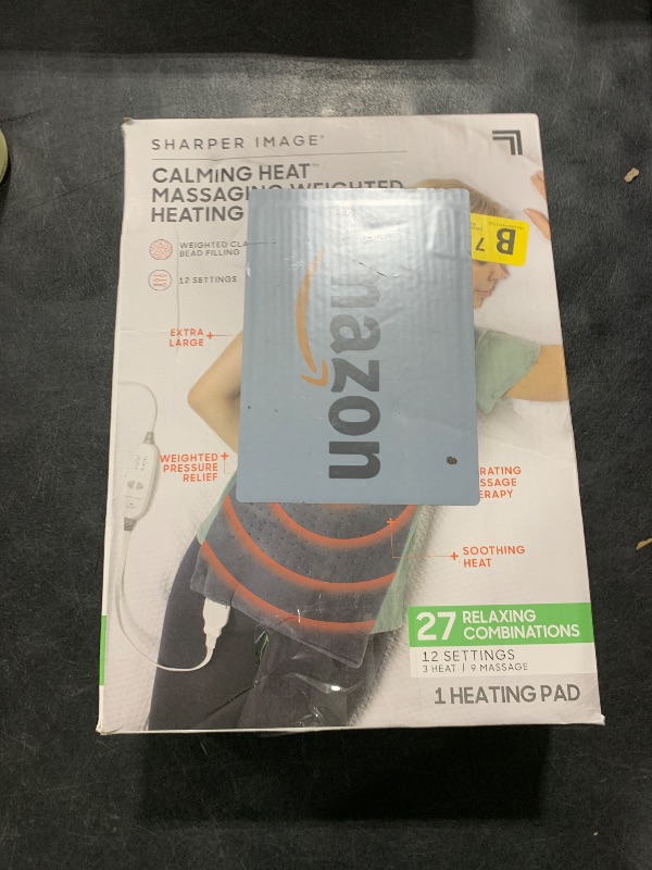 Photo 1 of Calming Heat Massaging Weighted Heating Pad by Sharper Image- Electric Heating Pad with Massaging Vibrations, Auto-Off,12 Settings- 3 Heat, 9 Massage- 27 Relaxing Combinations, 12” x 24”, 4lbs