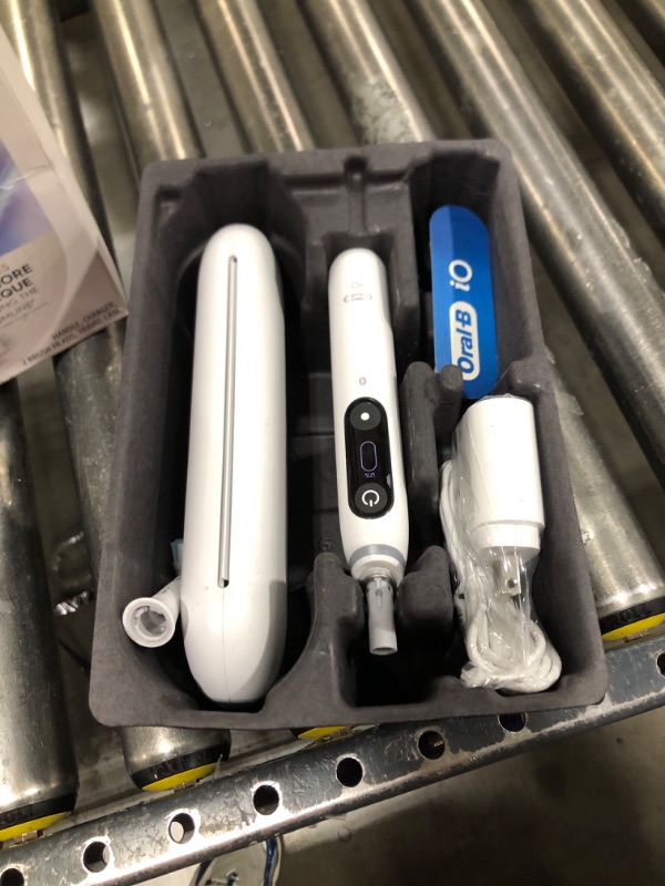 Photo 1 of Oral-B iO Deep Clean + Protect Rechargeable Electric Toothbrush, White with a iO Series 7 Toothbrush, 2 Replacement Brush Heads, and a Charging Travel Case