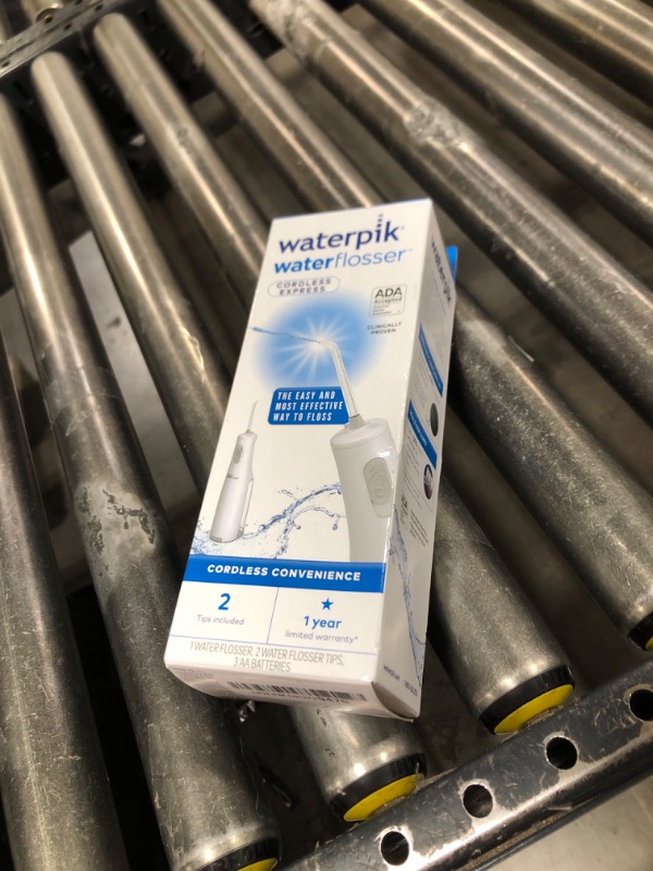 Photo 1 of Waterpik Cordless Express Water Flosser, Battery Operated & Portable for Travel & Home, ADA Accepted, Waterproof for Shower Use, White WF-02, Packaging May Vary