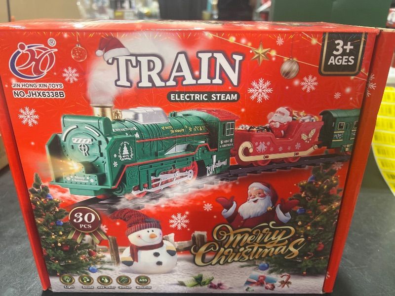 Photo 1 of Train Set - Electric Train Sets for Boys Toddlers, Toy Train with Steam Locomotive, Santa Claus Carriage, Train Carriages, Tracks, Smokes, Lights and Music, Christmas Train for 3 4 5 6 7 8+ Years Kids