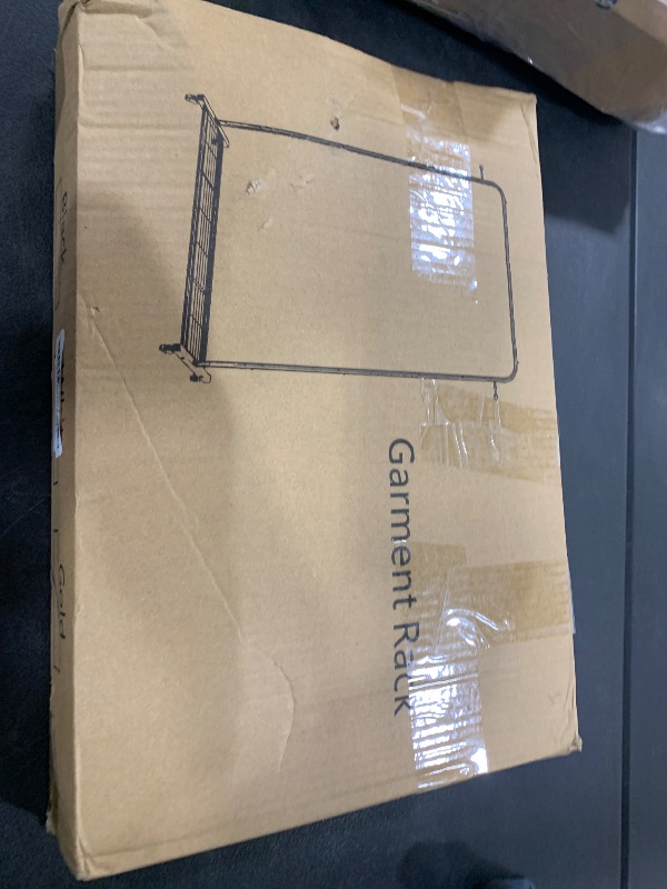 Photo 1 of Sywhitta Clothes Rack on wheels, Clothing Rack with Bottom Mesh Storage Shelf,Sturdy Metal Frame,Rolling Garment Rack for Hanging Clothes,Coats,Skirts,39.76" L x 16" W x 64.56" H,Golden