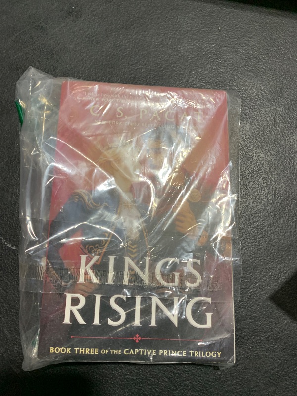 Photo 1 of Kings Rising (The Captive Prince Trilogy)