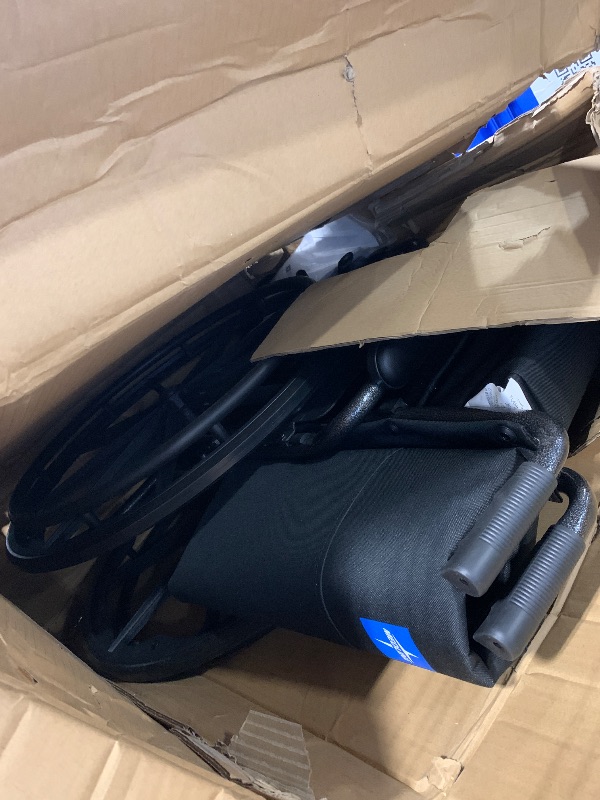 Photo 1 of **missing foot rest***
Medline Comfortable Folding Wheelchair with Swing-Back, Desk-Length Arms and Elevating Footrests, 20”W x 16”D Seat