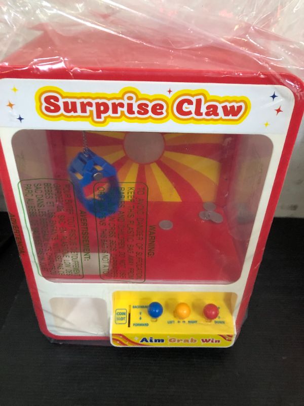 Photo 1 of JOYIN Claw Machine Arcade Toy with LED Light & Adjustable Sound, Rechargable Dispenser Toys Mini Vending Machine for Kids - Perfect Christmas & Birthday Big Gifts for Kids, Ages 3+