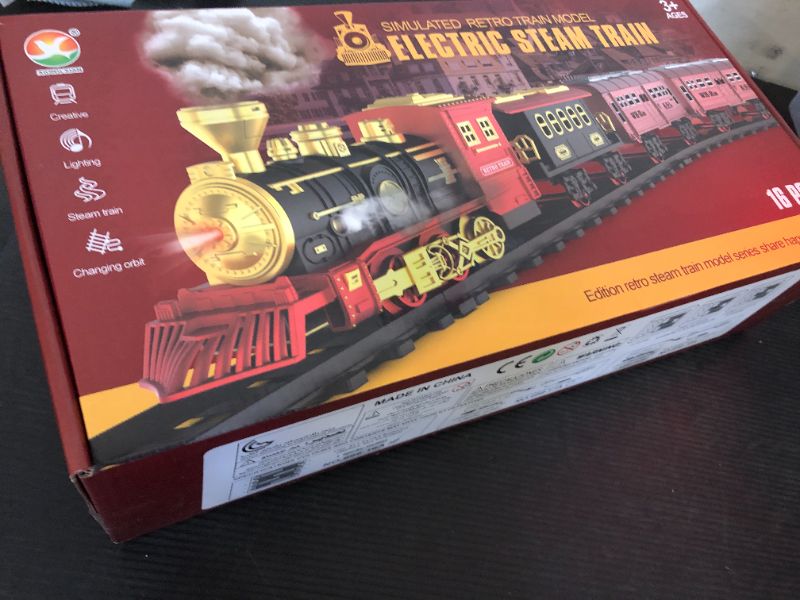 Photo 1 of Christmas Train Set with Smoke, Lights, and Sound - Ideal Gift for Toddlers and Kids Ages 2-8, Classic Electric Train Set for Under The Tree, Holiday Decoration for Boys & Girls