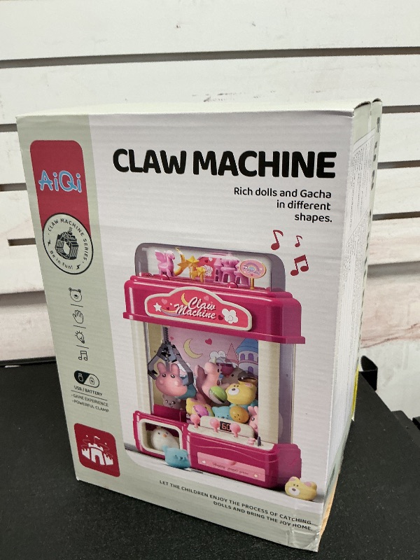 Photo 1 of Aiqi 55 PCS Kids Claw Machine, Large Candy Vending Grabber, Prize Dispenser Toys for Girls Boys with Lights Sound, Electronic Claw Game Machine Toys for 3 4 5 6 7 8 Years Old Girls