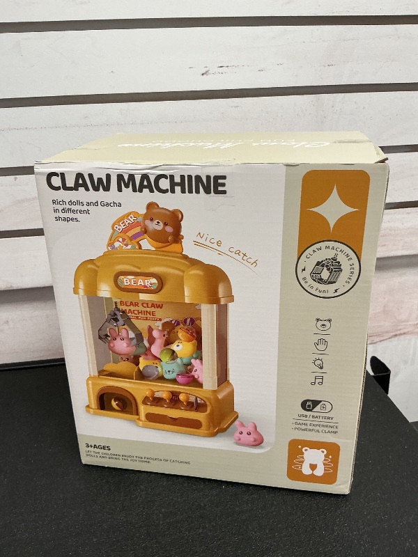 Photo 1 of Aiqi 55 PCS Large Bear Kids Claw Machine,Candy Vending Grabber,Prize Dispenser Toys for Girls and Boys,Electronic Game Machine Party Birthdays with Lights Sound,Includes 30 Toys and 25 Game Coins