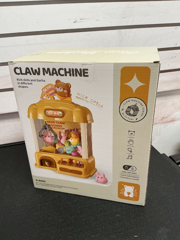 Photo 1 of Aiqi 55 PCS Large Bear Kids Claw Machine,Candy Vending Grabber,Prize Dispenser Toys for Girls and Boys,Electronic Game Machine Party Birthdays with Lights Sound,Includes 30 Toys and 25 Game Coins