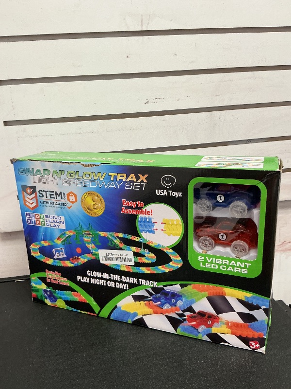 Photo 1 of USA Toyz Glow Trax Glow in The Dark Race Tracks for Kids- Speedway Race Car Track Set with 360pk Flexible Roads, 2 Light Up Toy Cars, Bridges, Ramps, Play Set STEM Building Toys for Boys and Girls