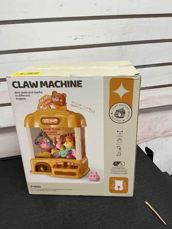 Photo 1 of Aiqi 55 PCS Large Bear Kids Claw Machine,Candy Vending Grabber,Prize Dispenser Toys for Girls and Boys,Electronic Game Machine Party Birthdays with Lights Sound,Includes 30 Toys and 25 Game Coins