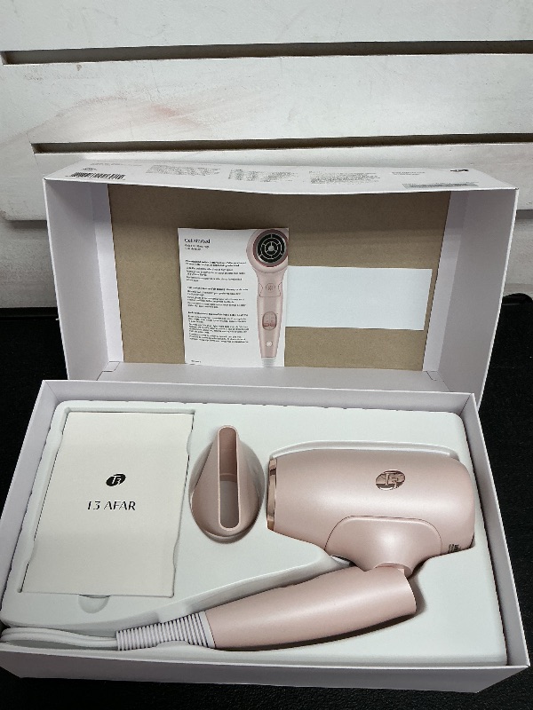 Photo 1 of T3 Afar Lightweight Travel-Size Hair Dryer with Auto Dual Voltage, Folding Handle, Fast Drying, Lightweight and Ergonomic, Frizz Smoothing, Multiple Heat and Speed Combinations