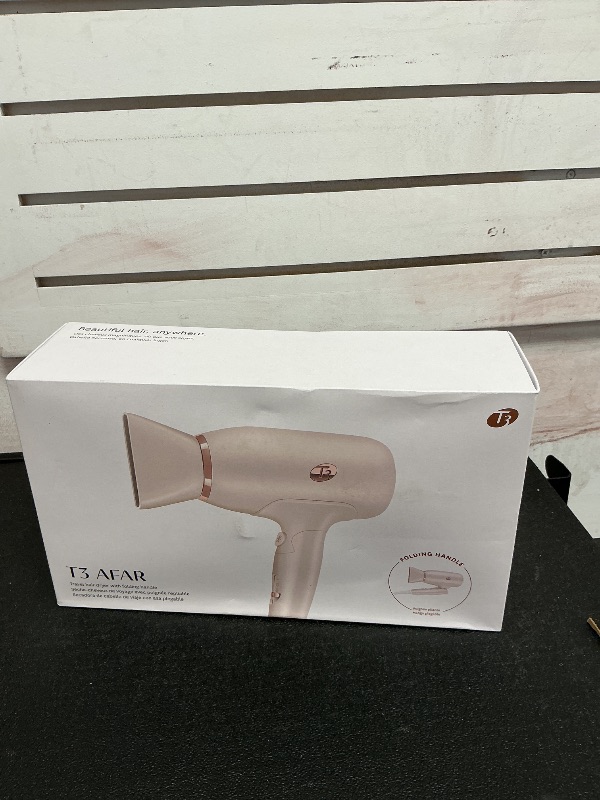 Photo 1 of T3 Afar Lightweight Travel-Size Hair Dryer with Auto Dual Voltage, Folding Handle, Fast Drying, Lightweight and Ergonomic, Frizz Smoothing, Multiple Heat and Speed Combinations