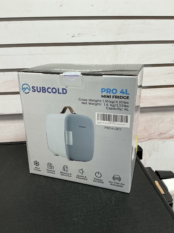 Photo 1 of Subcold Pro4 Luxury Mini Fridge Cooler 4 Litre / 6 Cans AC & Exclusive USB ECO Power Option | Portable Small Refrigerator For The Office, Bedroom, Car, Travel, Skincare & Cosmetic (Gray)